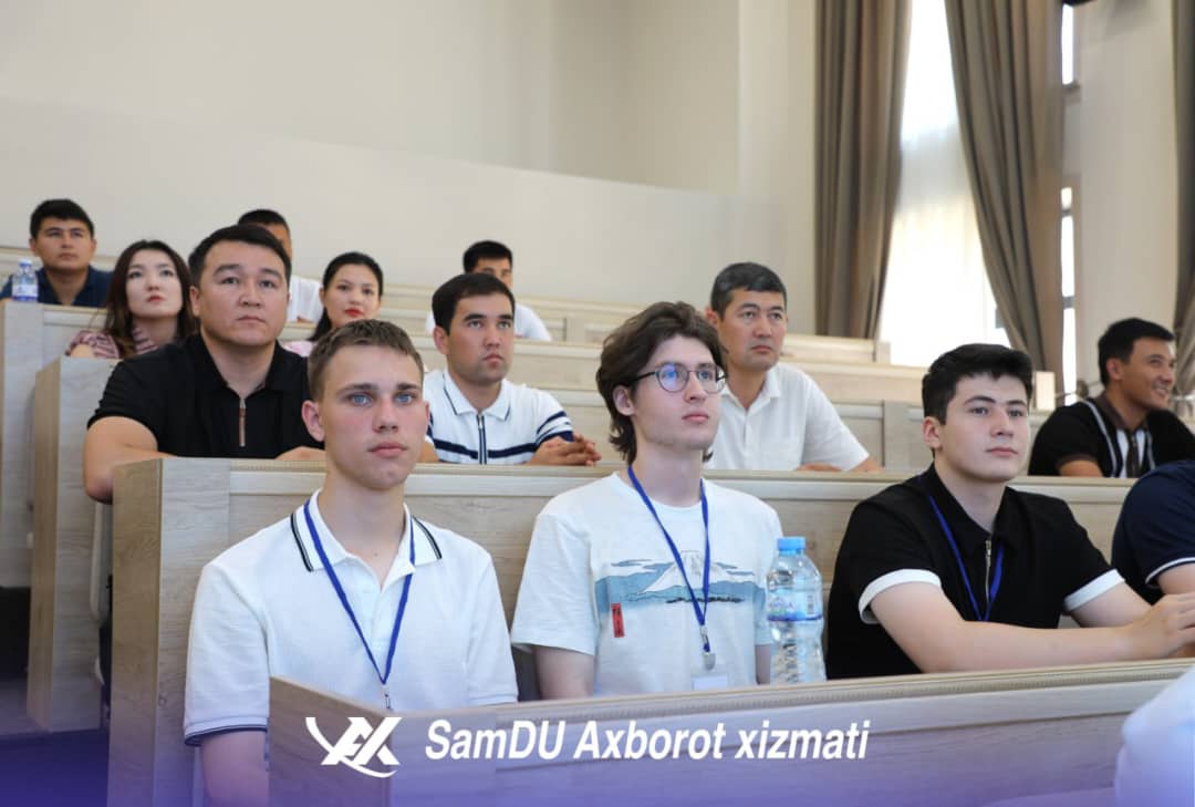 Students engaged in quantum computing theory session with international professors